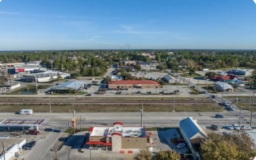 Overhead view of Magnolia TX with expanding residential communities and strong home-buying demand.