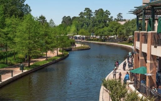 Scenic view of The Woodlands Waterway with walking paths and residential areas