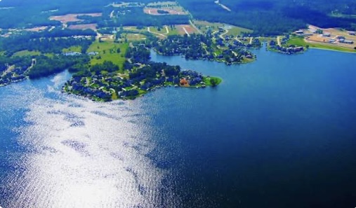 Scenic view of Lake Conroe in Texas with waterfront homes and nearby real estate communities.