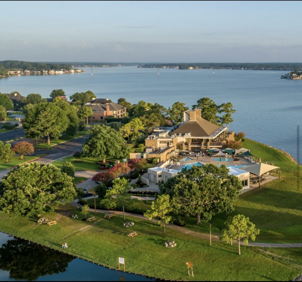Peaceful view of Lake Conroe with boats and waterfront homes in Texas